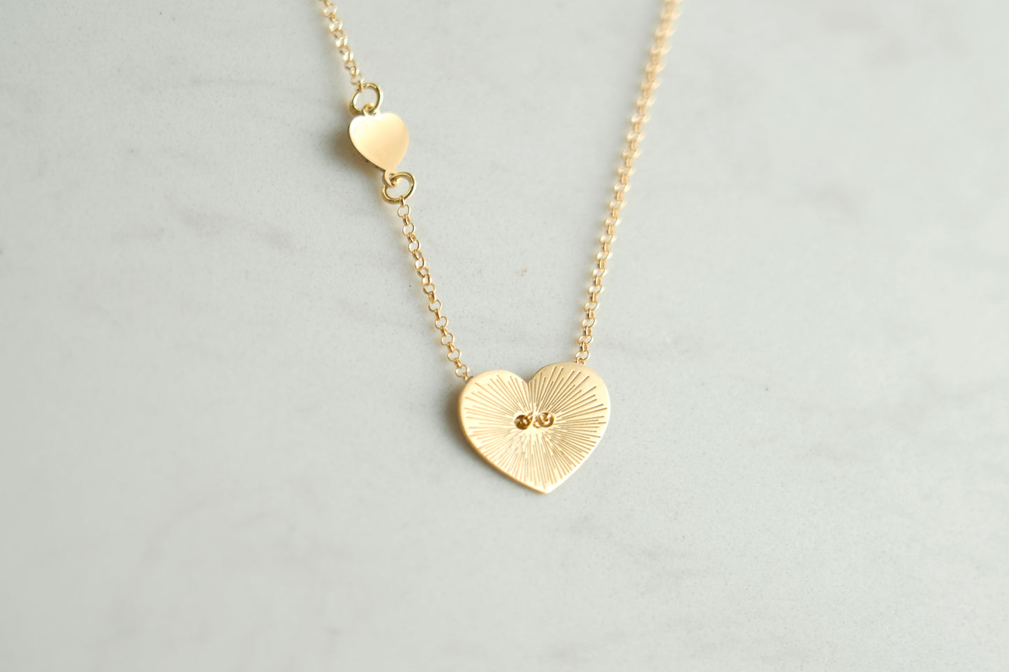 Heart ray necklace